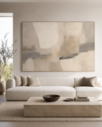 Large greige abstract wall art above a cream sofa