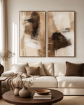 Brown and beige abstract diptych above a cream sofa