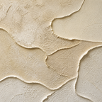Close-up of sand beige raised plaster texture